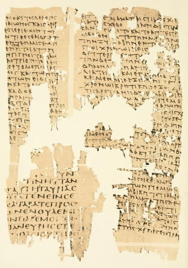 A papyrus fragment with two columns of Greek in a small upright hand, with holes and losses.