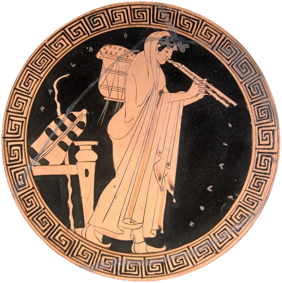 Red-figure cup interior: a figure playing the double pipes.