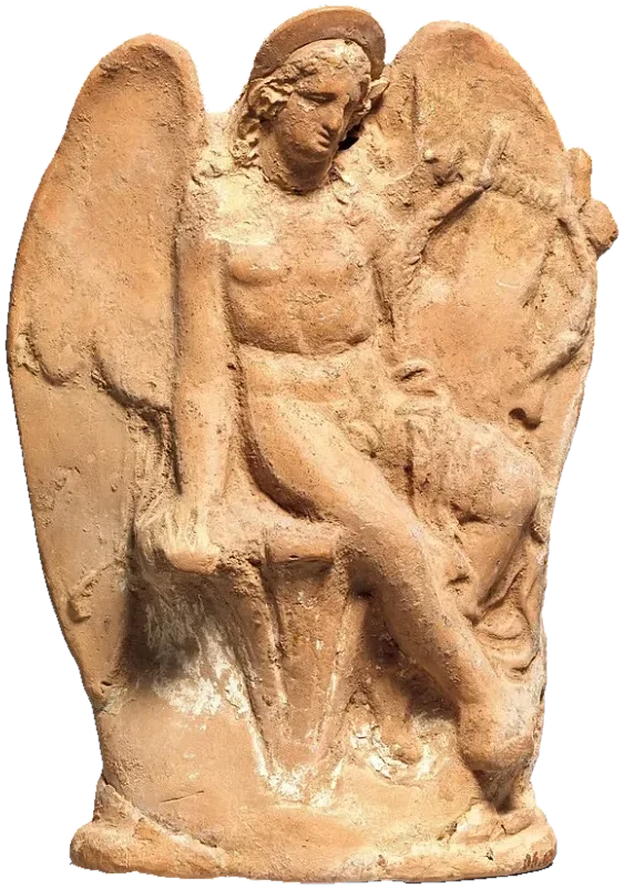 A small clay figure of a winged boy sitting on a rock.