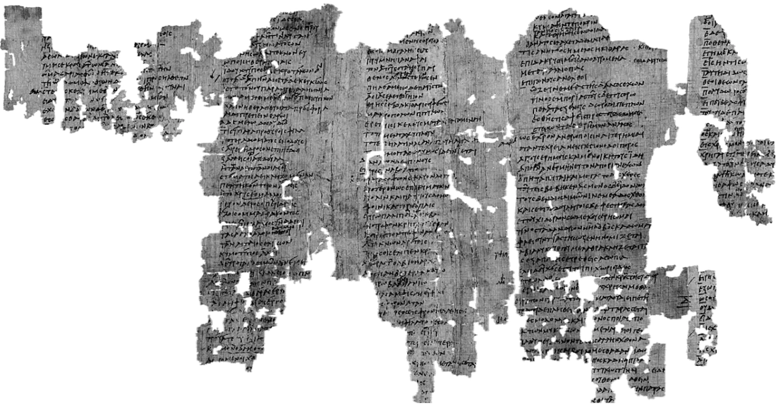 Black-and-white photograph of a large papyrus fragment with three columns of Greek script, much broken.