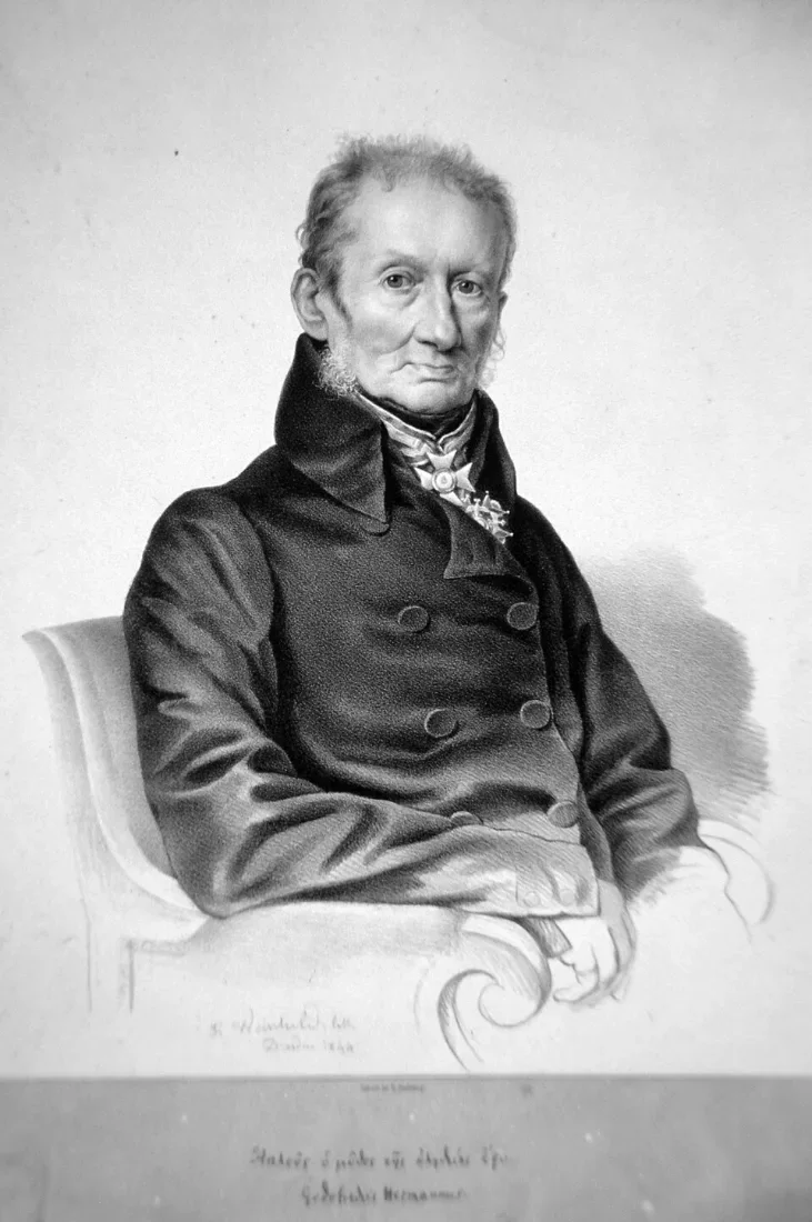A lithograph portrait of an elderly man in a high collar, seated.