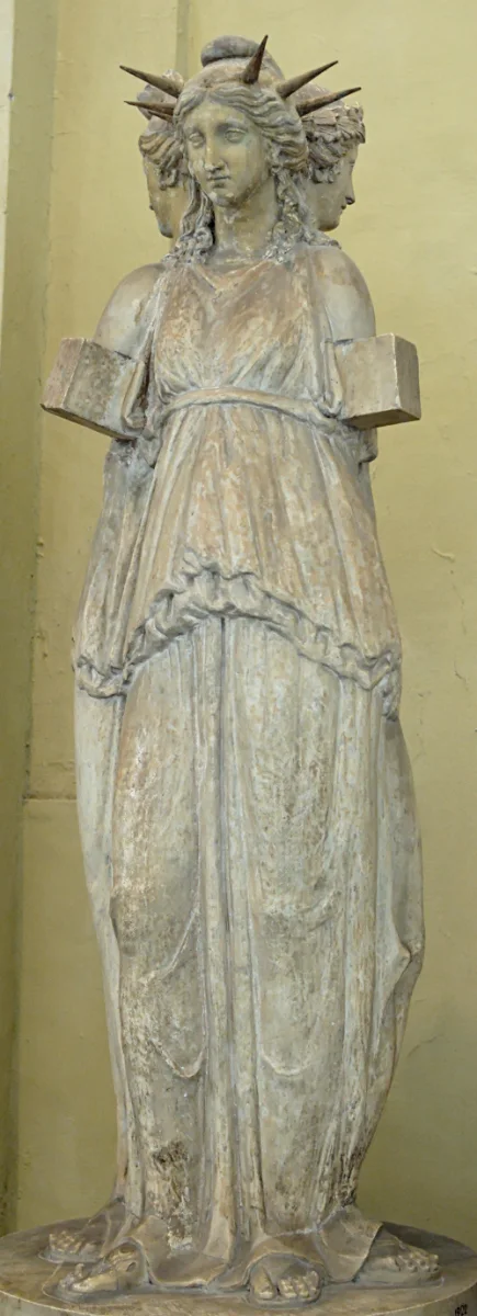 Marble statue of a goddess in triple form, three draped figures back to back, crowned.