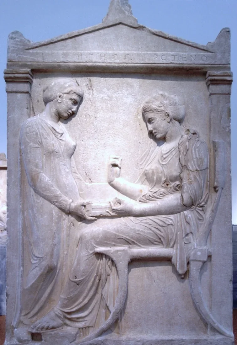 A marble grave relief: a seated woman takes jewellery from a box held by a standing girl.