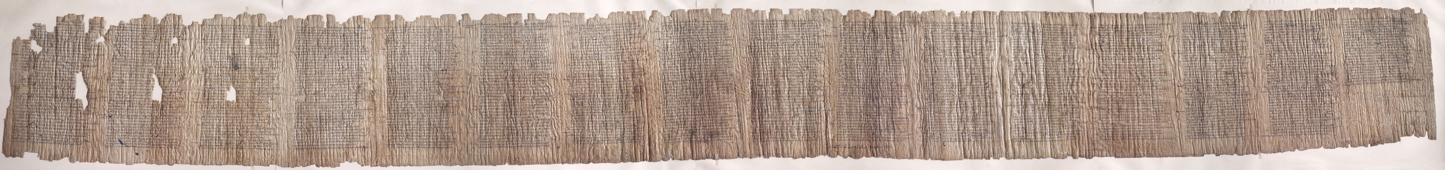 A long strip of papyrus with several columns of Greek text.