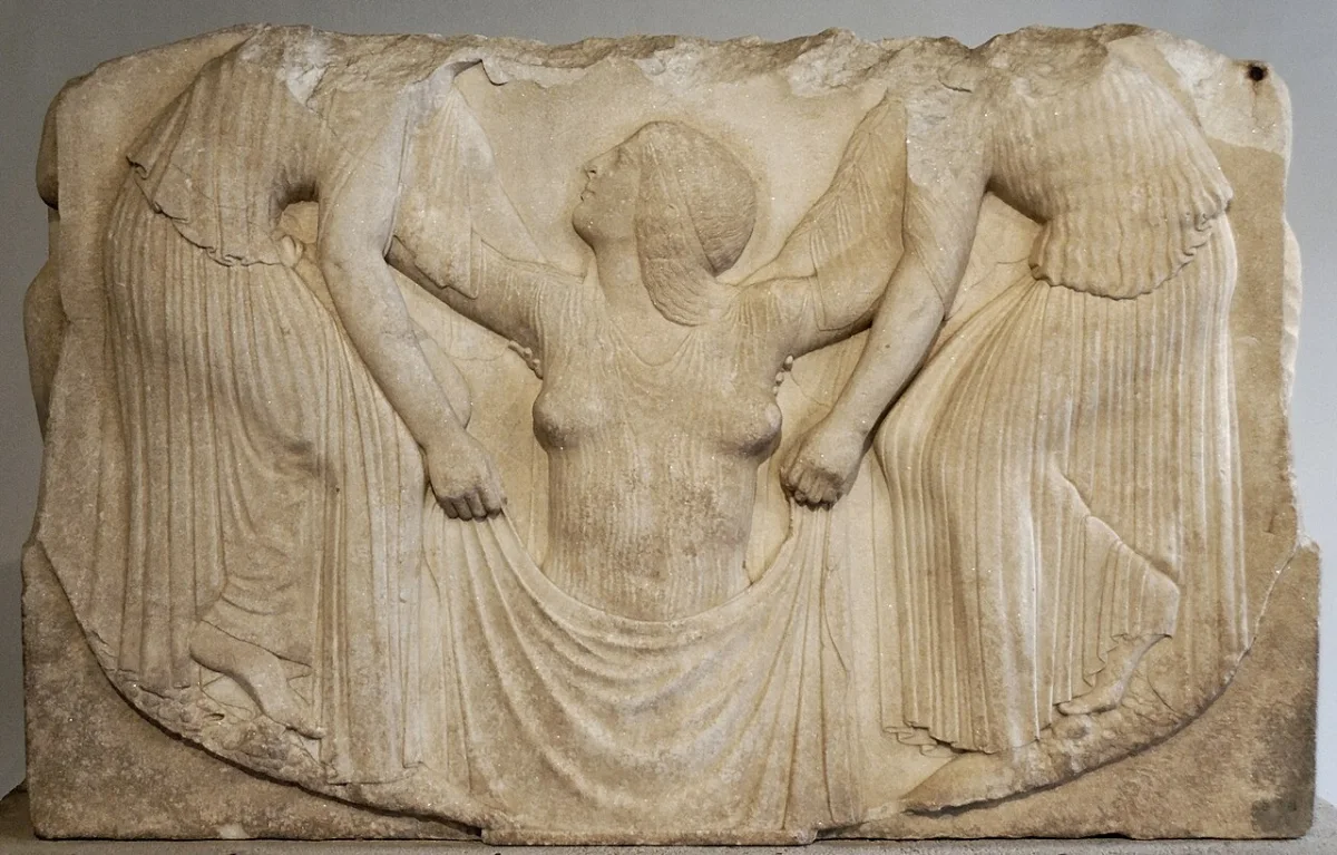 Marble relief: a goddess rises from the water, lifted by two women who hold a cloth before her.