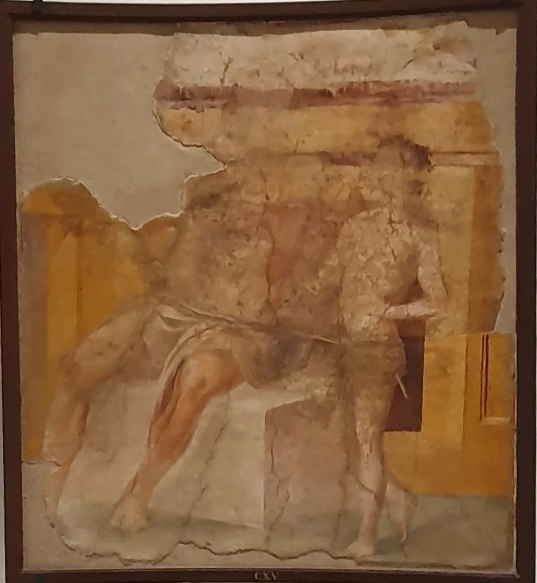Faded wall painting: a seated bearded satyr teaches a youth standing before him.