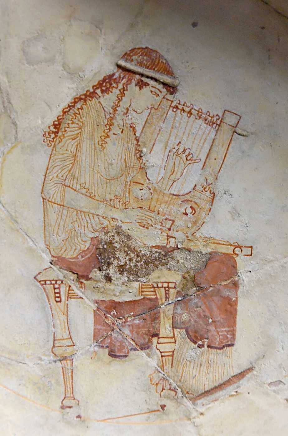 White-ground painting of a seated woman in a red cloak holding a stringed instrument.
