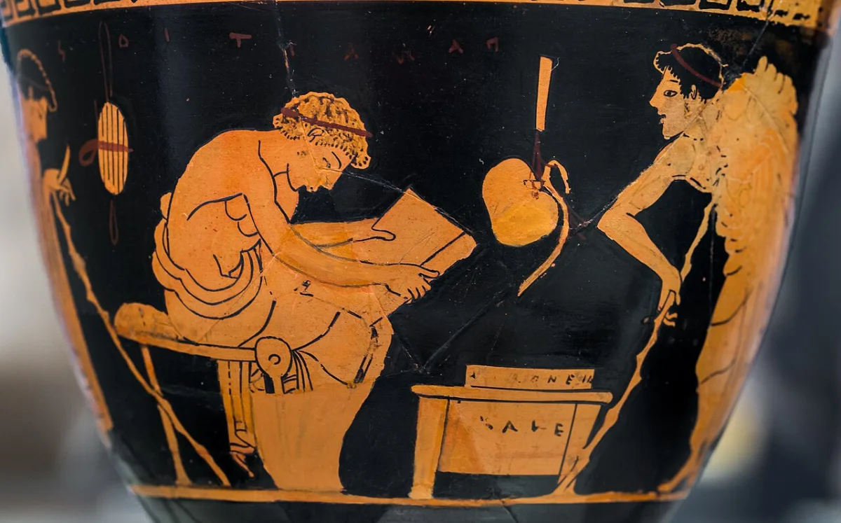 Red-figure cup: a seated youth reads from an open papyrus roll; another youth, leaning on a stick, listens.