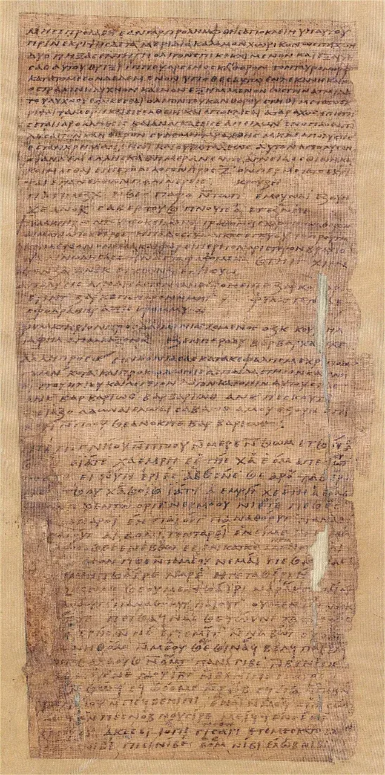 A tall papyrus page densely written in Greek.